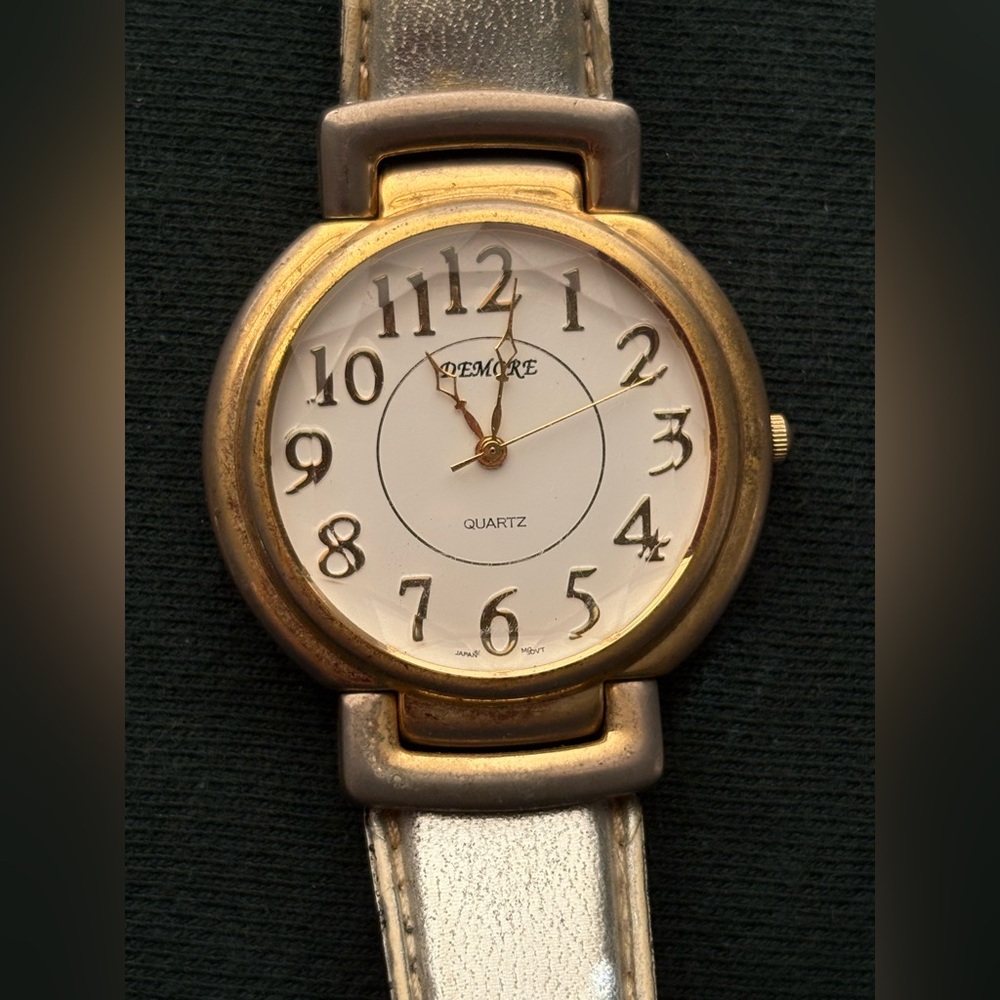 Vintage Demore brand watch with silver colored leather strap-not sure if working